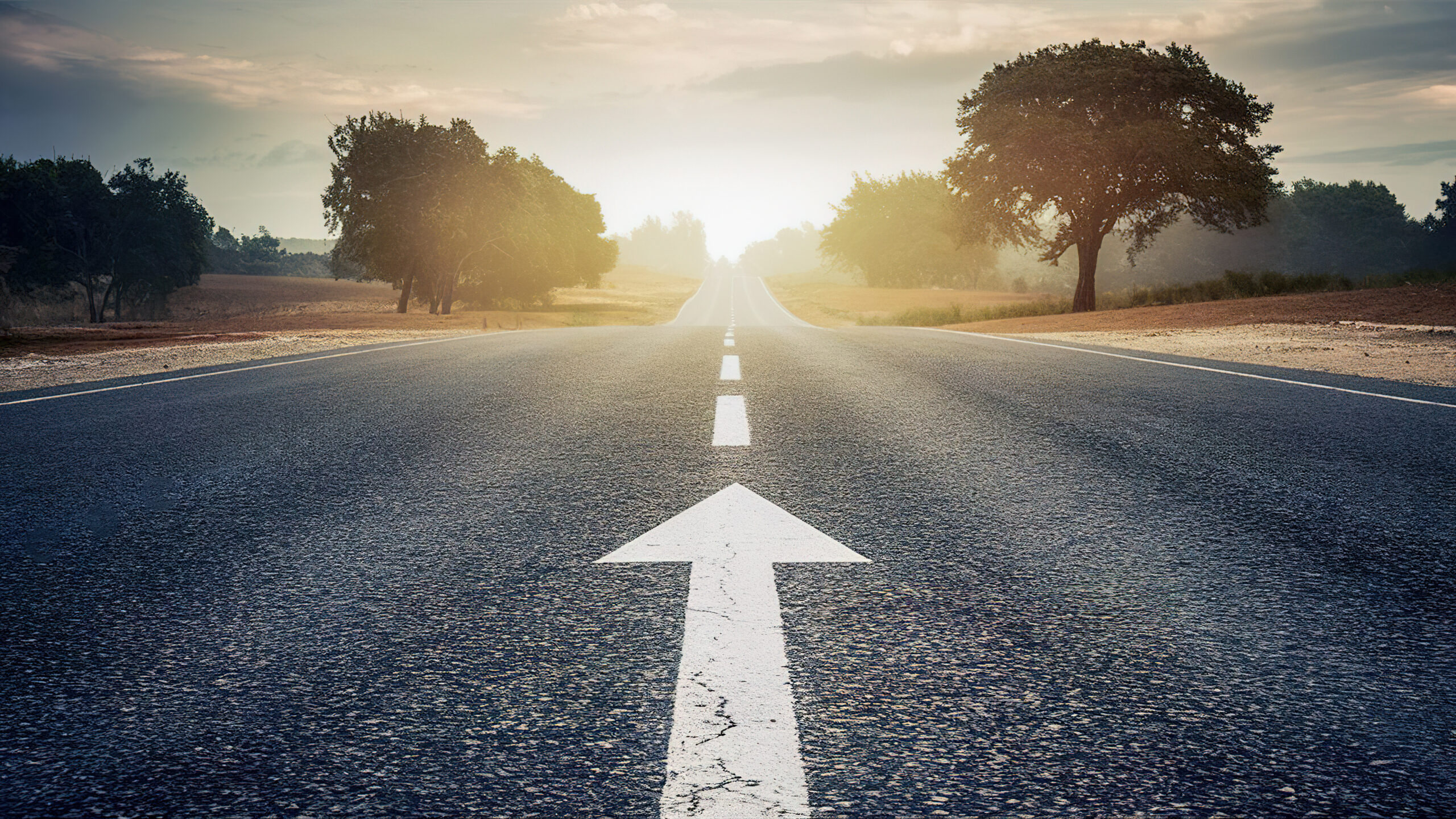 An open road with an arrow signifying direction concept photo for starting a journey. High quality photo